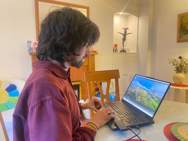 John O Ackerman with eye of the storm on screen