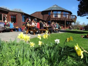 Not infrequent glorious sunny weather always encouraged the community to enjoy lunch outside the Community Centre. Sadly the building along with the main meditation sanctuary went up in flames at the height of Covid and mass redundancies. The arsonist, who struck a blow at the social and spiritual heart of the community, handed himself over to the authorities within hours. photo Geoff Dalglish