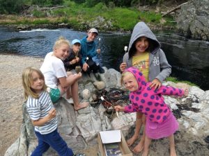 Toasting marshmallows alongside the Findhorn River with the younger set during Family Experience Week. photo Geoff Dalglish