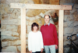 Doorway carved by Richard Brockbank, here with Liz Ward photo Alan Jacobsen
