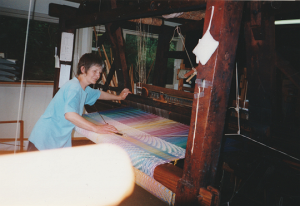 Jane weaving Sunrise panel 1998