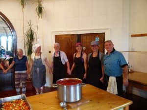 Cooking in Cluny kitchen - blessing the food photo Cornelia Featherstone