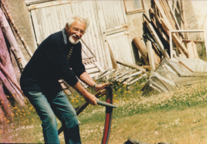 Fred Barton sharpening scythe photo Lynn Barton